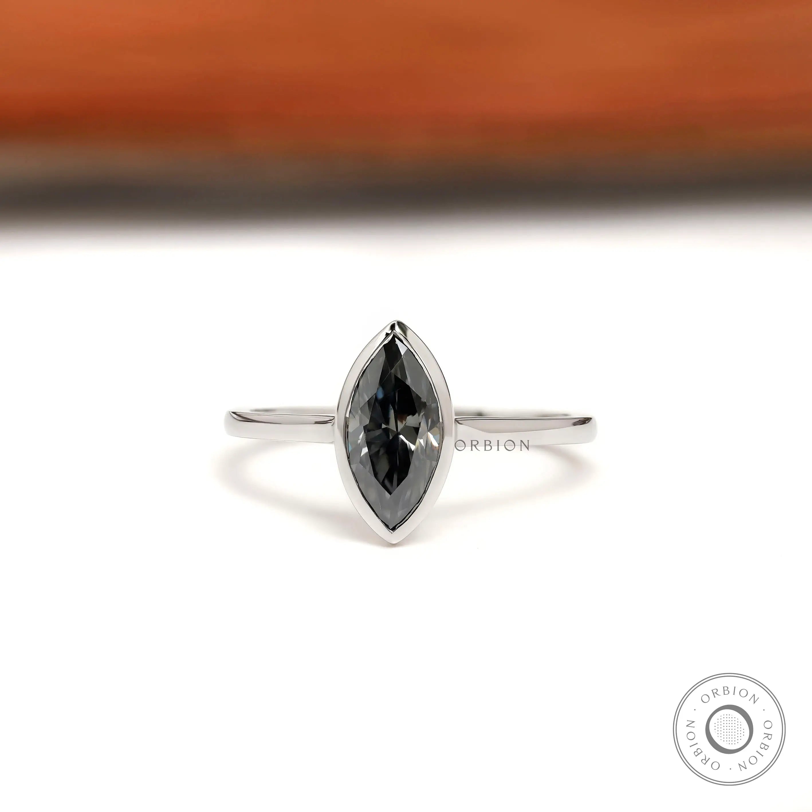 Marquise grey moissanite bezel set solitaire ring in 14K white gold front view
