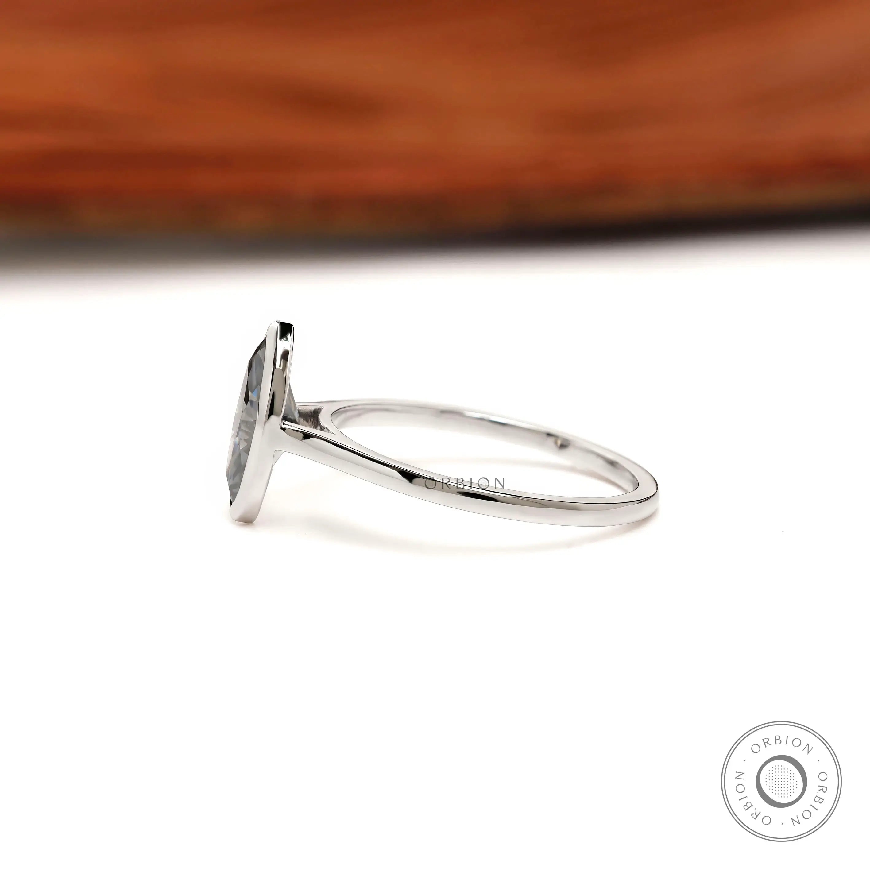 Low profile marquise moissanite solitaire ring in white gold
