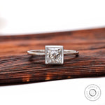 Princess cut lab grown diamond bezel solitaire ring in 14K white gold front view