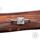 Princess cut lab grown diamond bezel solitaire ring in 14K white gold front view