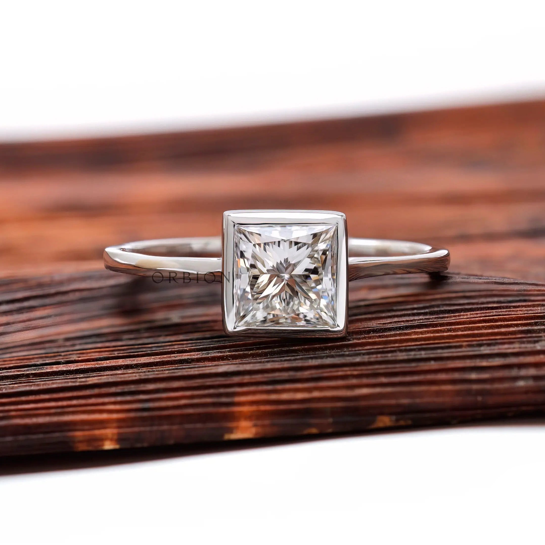 Princess cut lab grown diamond bezel solitaire ring in 14K white gold front view