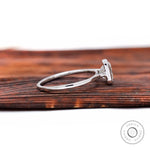 Side profile of princess diamond bezel solitaire ring