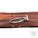 Side profile of princess diamond bezel solitaire ring
