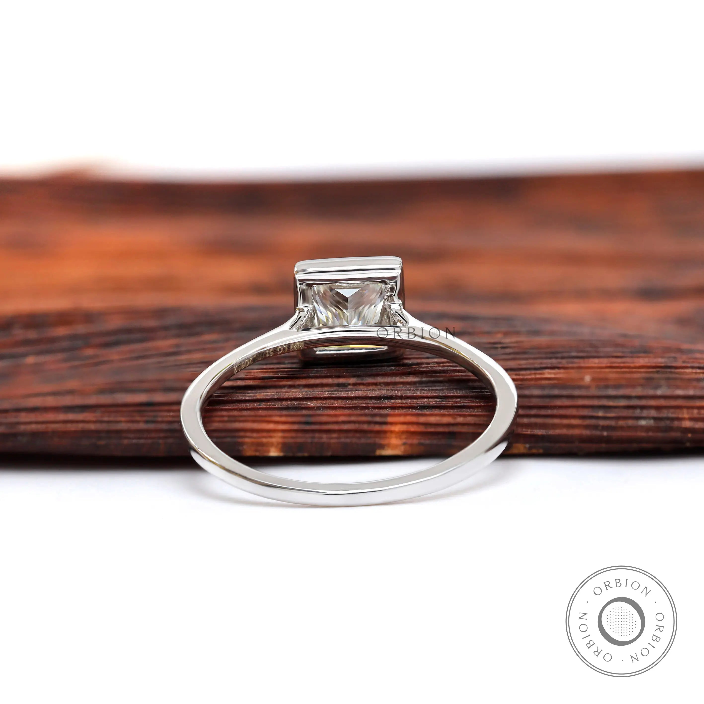 Back view of princess cut bezel diamond solitaire ring