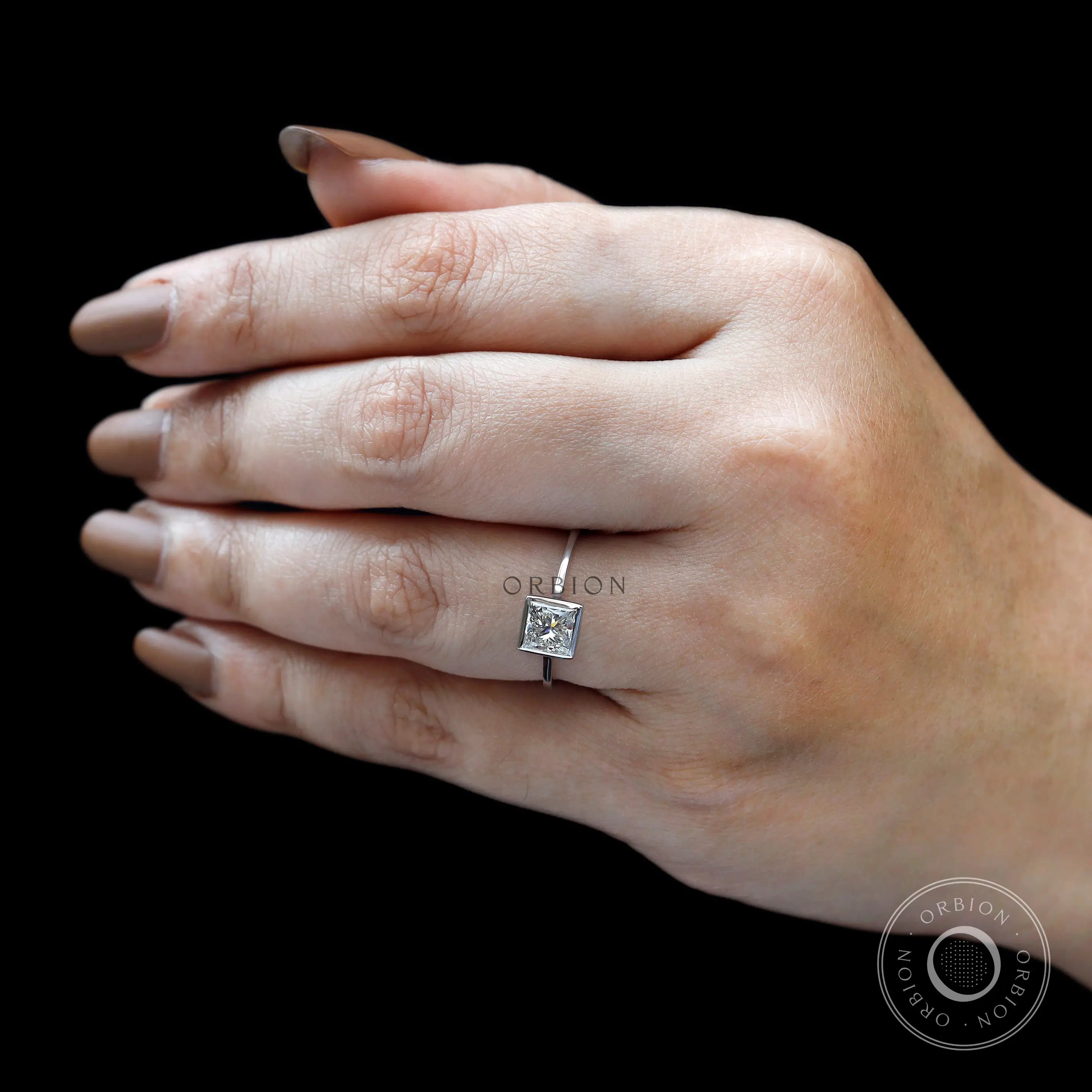 Minimalist bezel set princess diamond solitaire ring lifestyle view