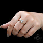 Double prong oval moissanite ring close-up