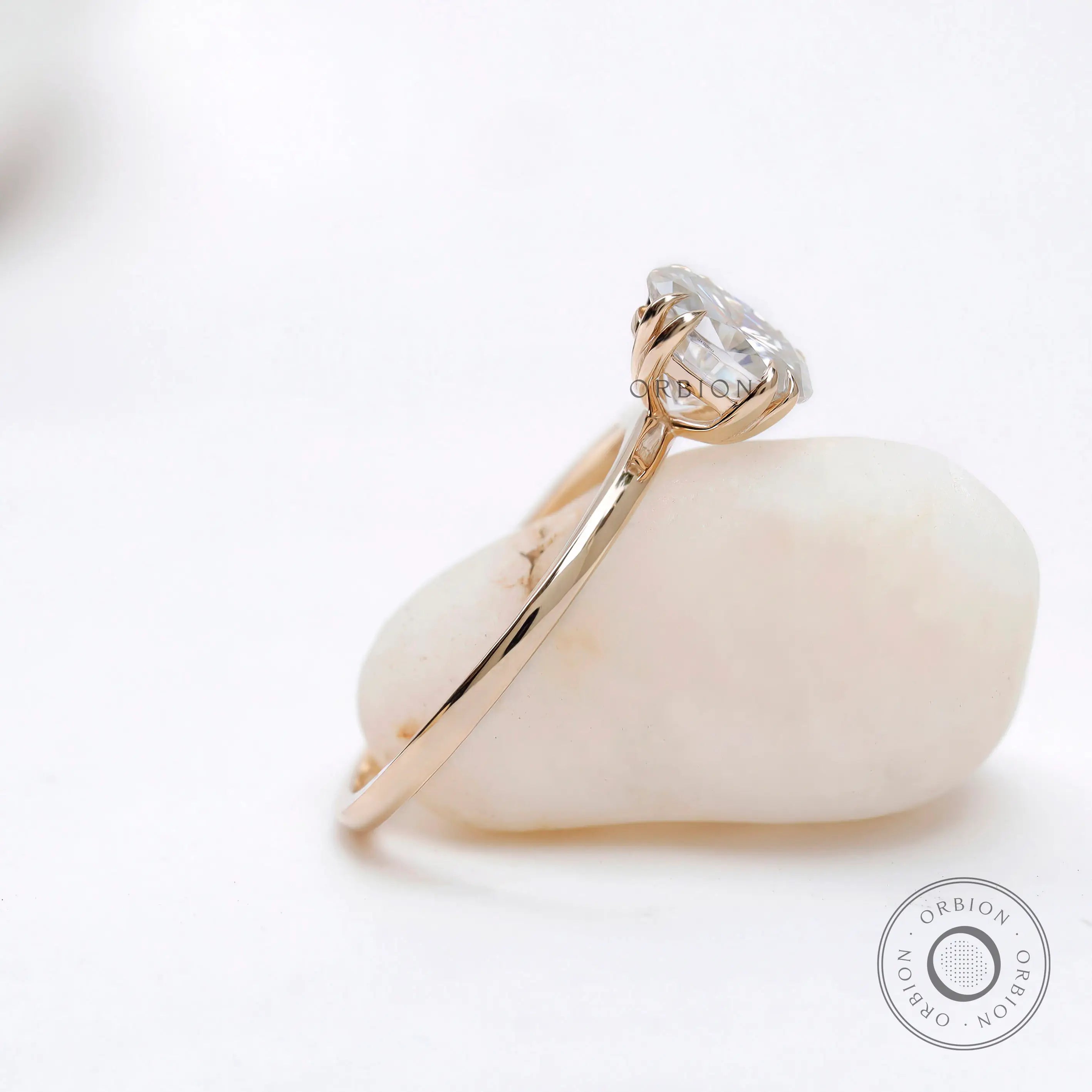 Oval-cut moissanite ring with polished yellow gold band