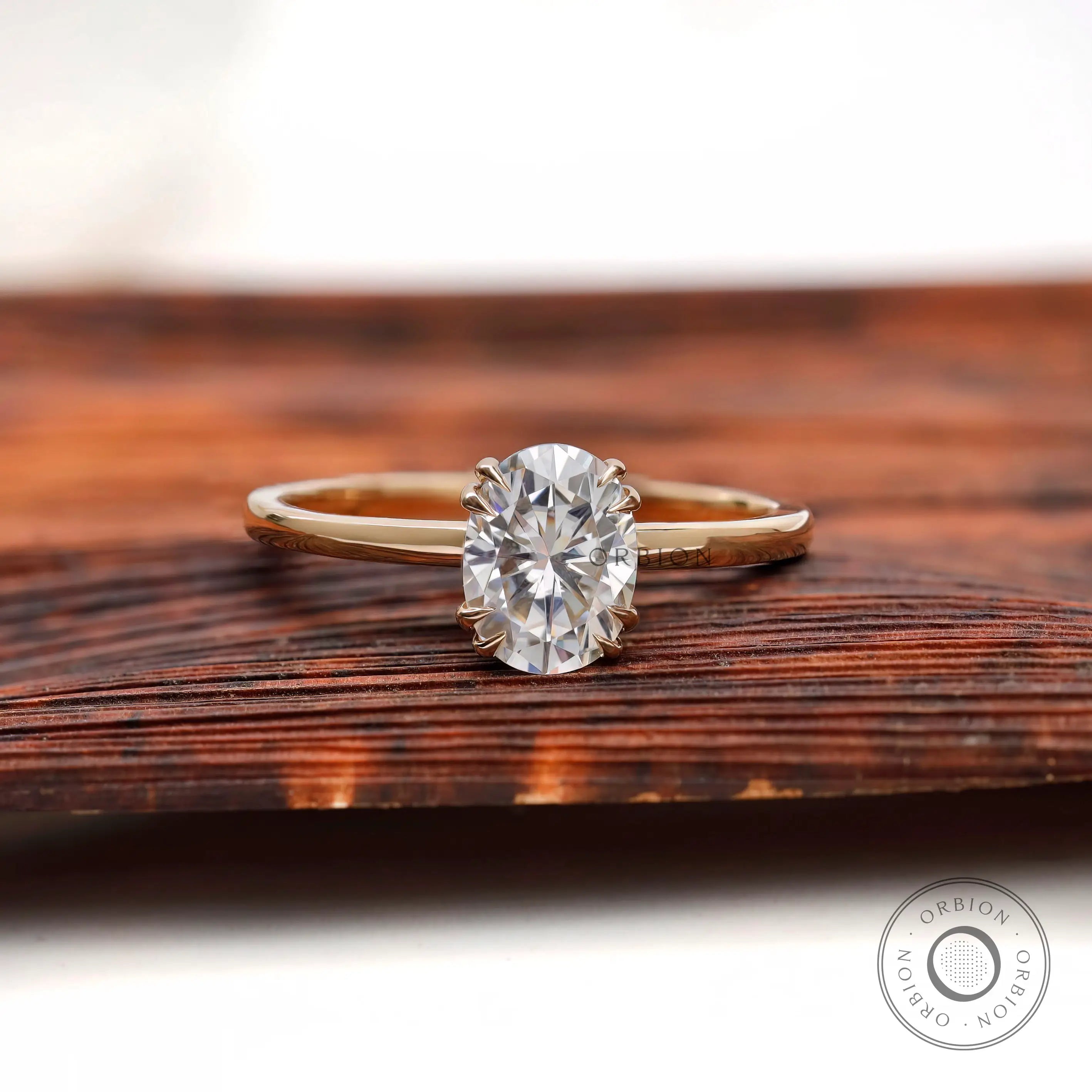 Yellow gold solitaire ring with oval moissanite top view
