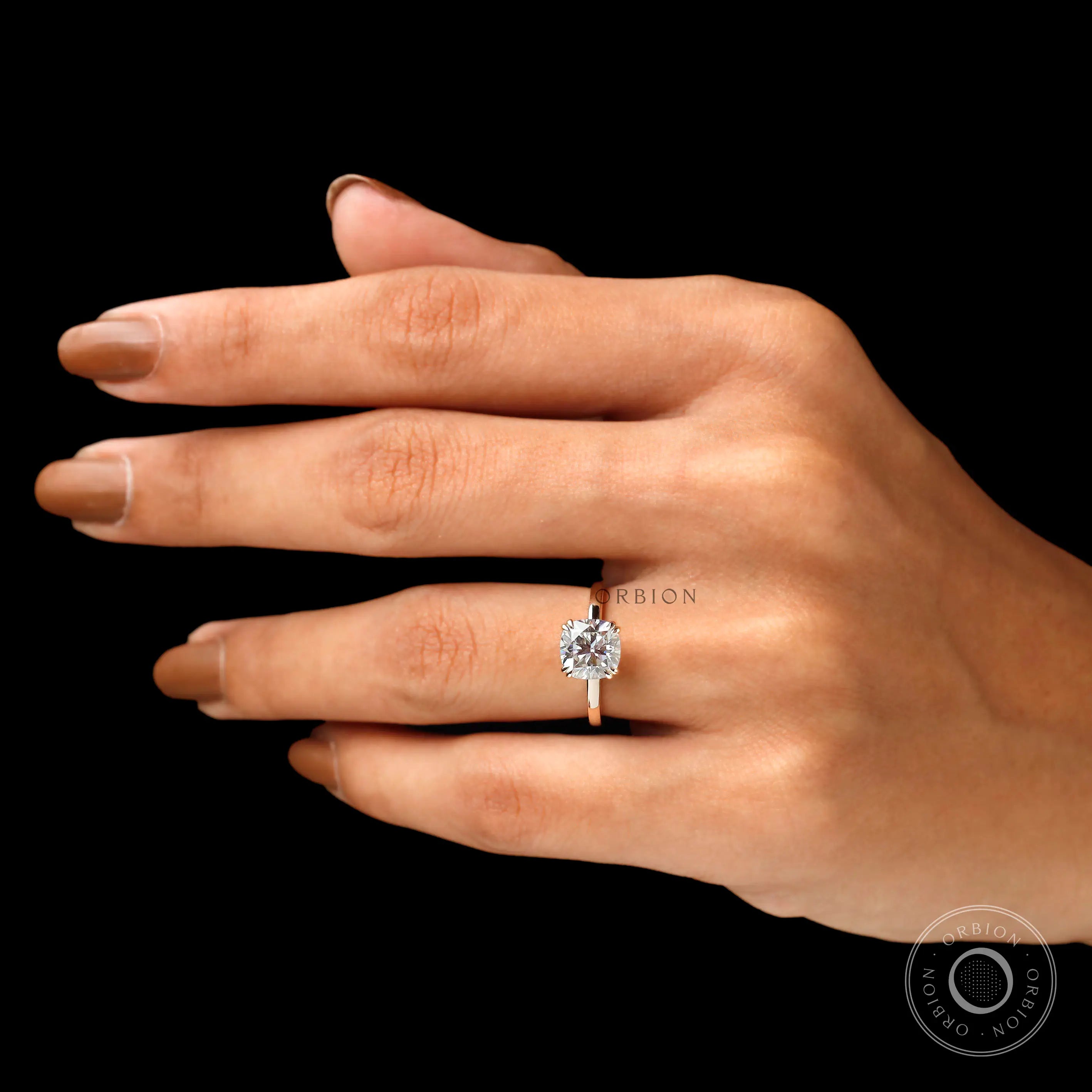 Cushion cut center stone solitaire ring on fingure