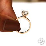 Elevated martini setting solitaire ring in 14K yellow gold, side detail view