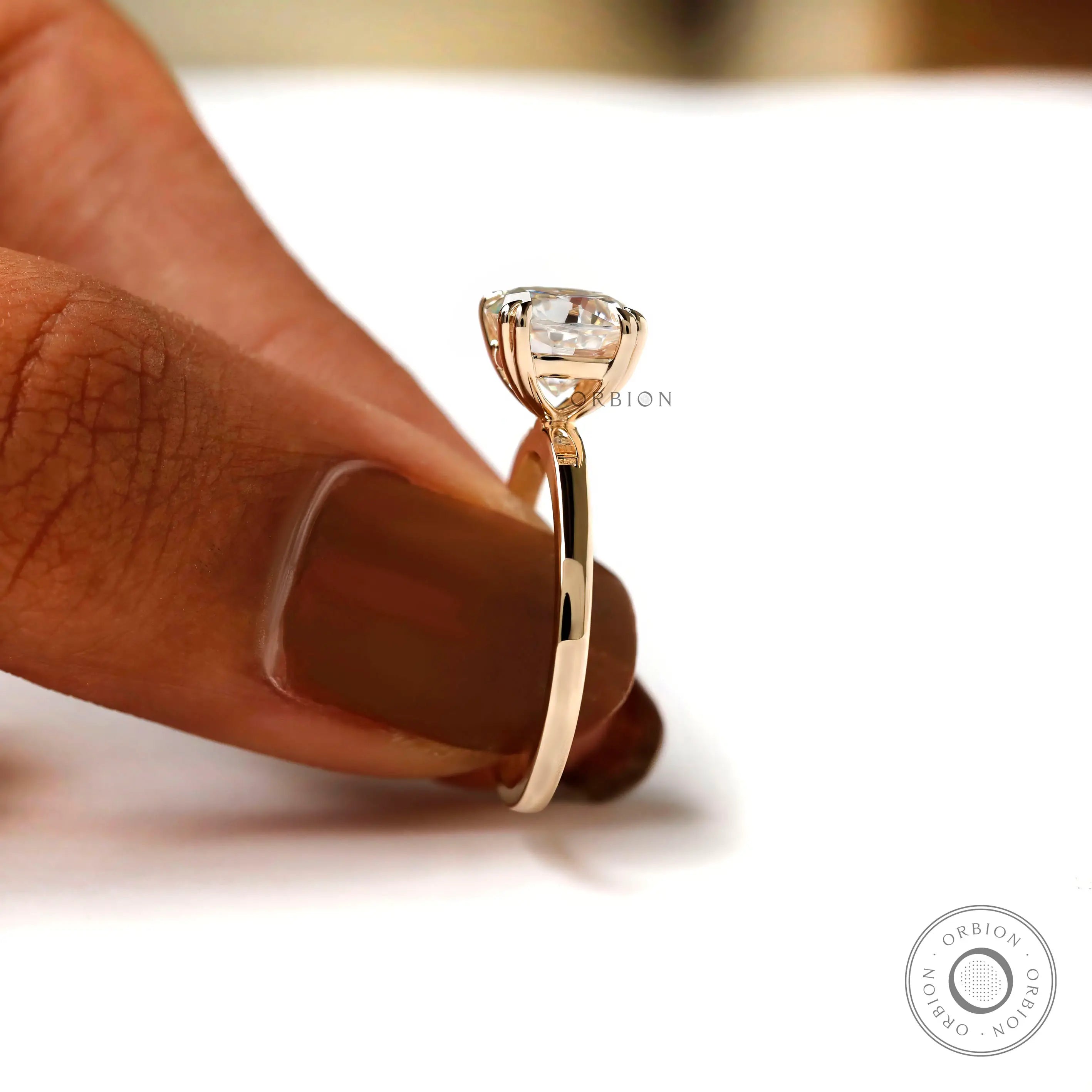 Yellow gold shank cushion solitaire ring, side angle view