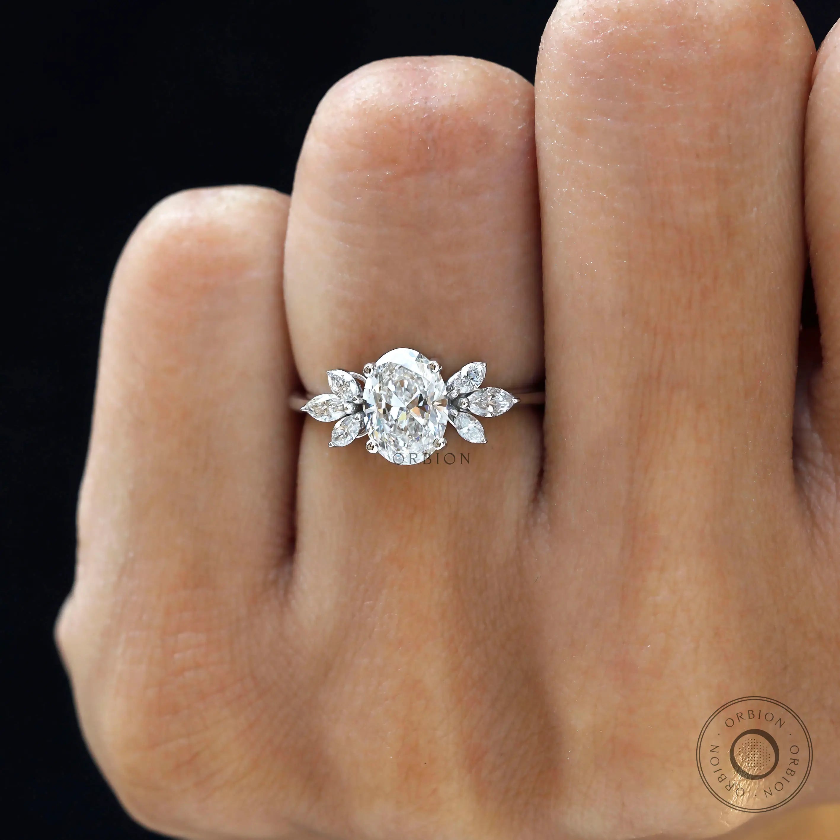 Classic floral engagement ring with marquise side stones