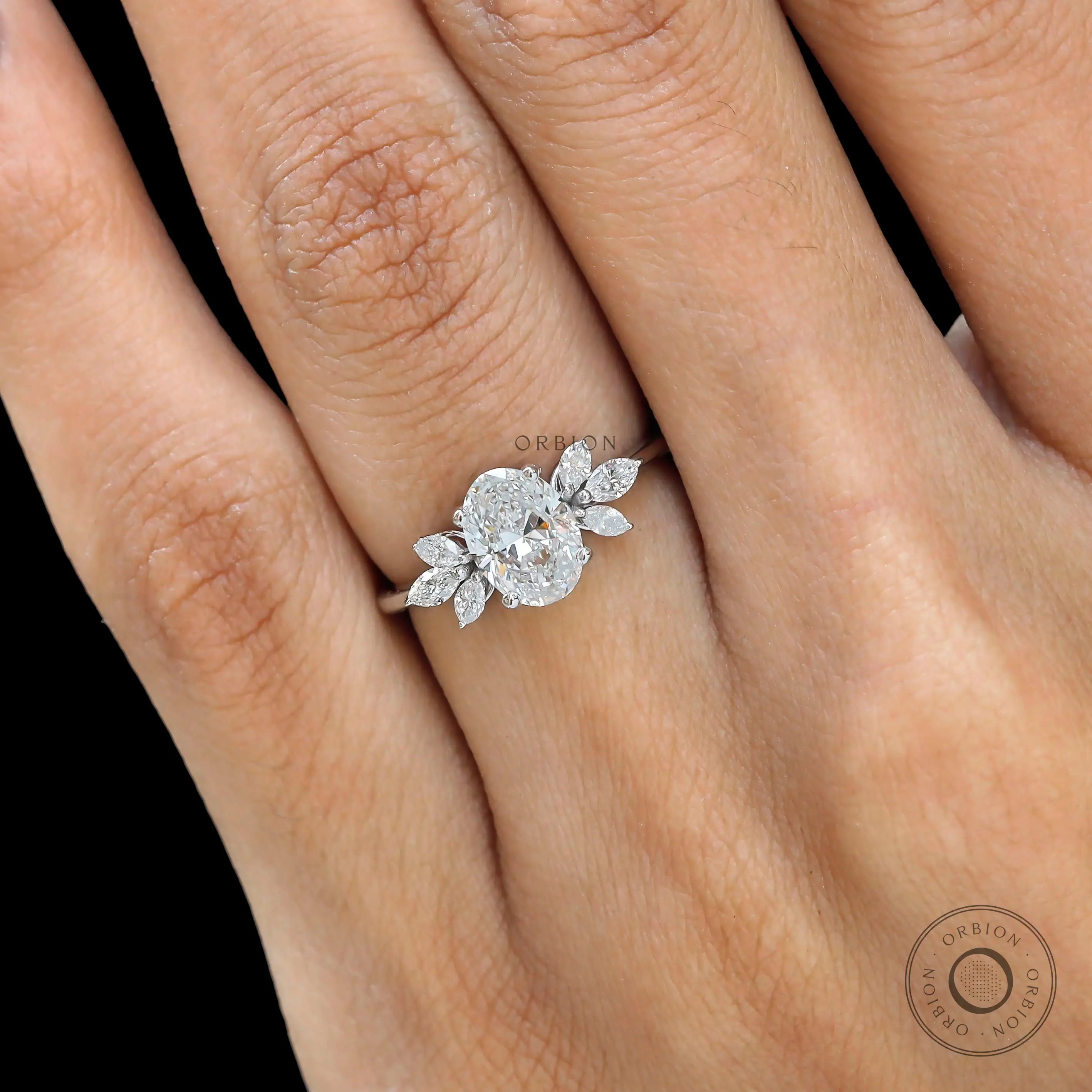 Delicate marquise detailing on floral solitaire ring