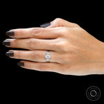 Feminine floral engagement ring worn on hand