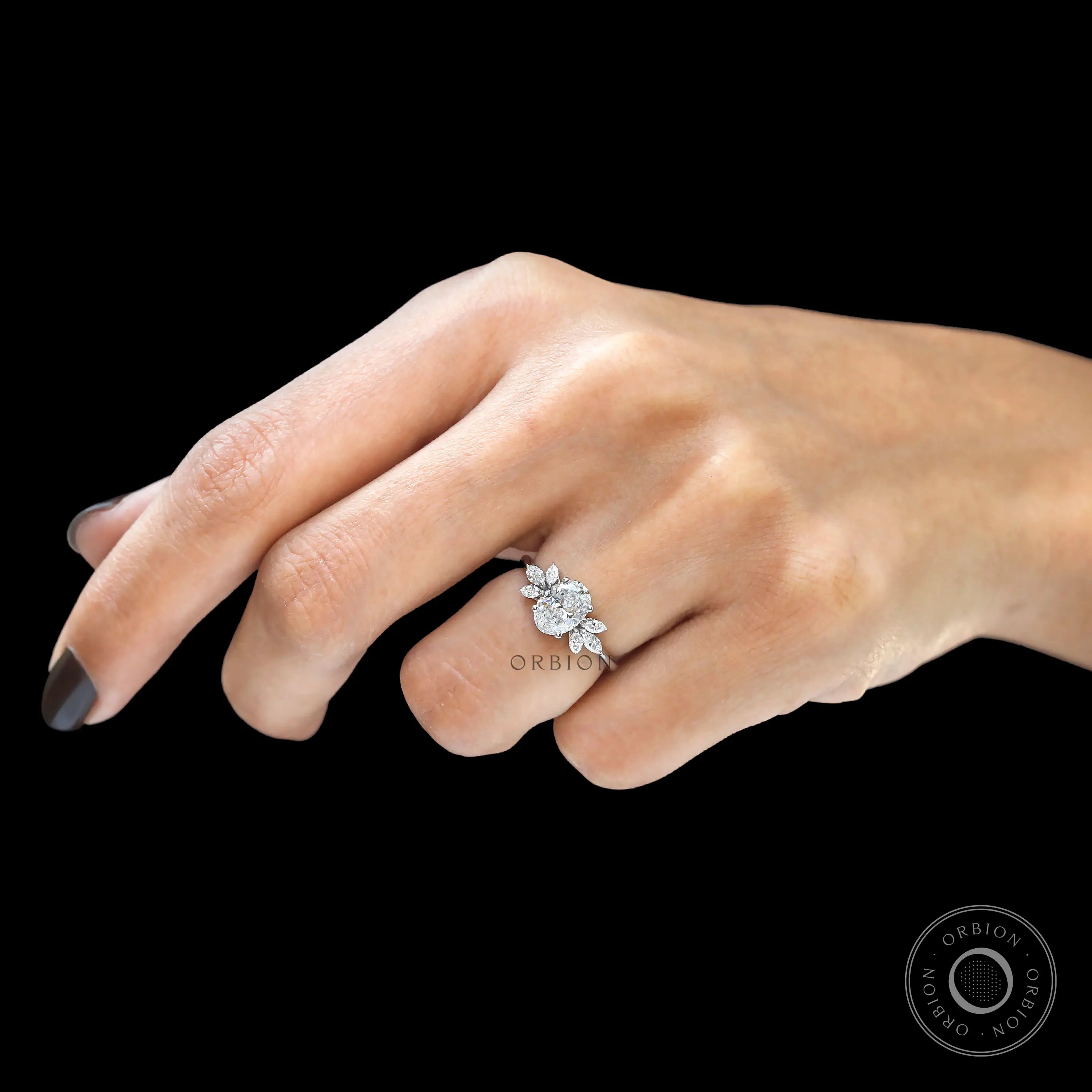 White gold floral engagement ring with oval center stone