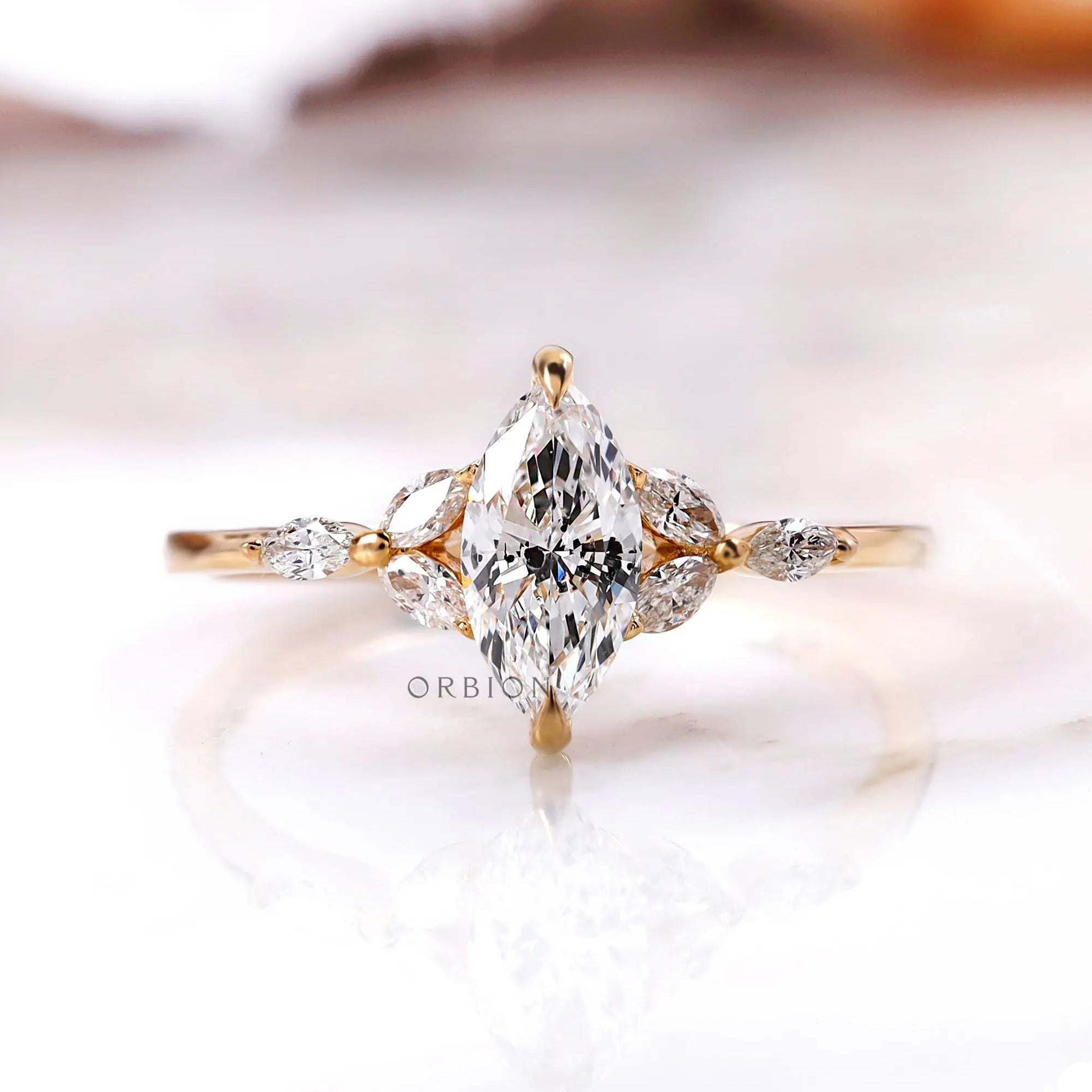 Marquise lab grown diamond cluster engagement ring in 14K yellow gold