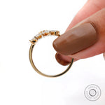 Slim yellow gold band with diamond leaf motif