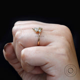 Yellow gold diamond leaf ring highlighting tapered band