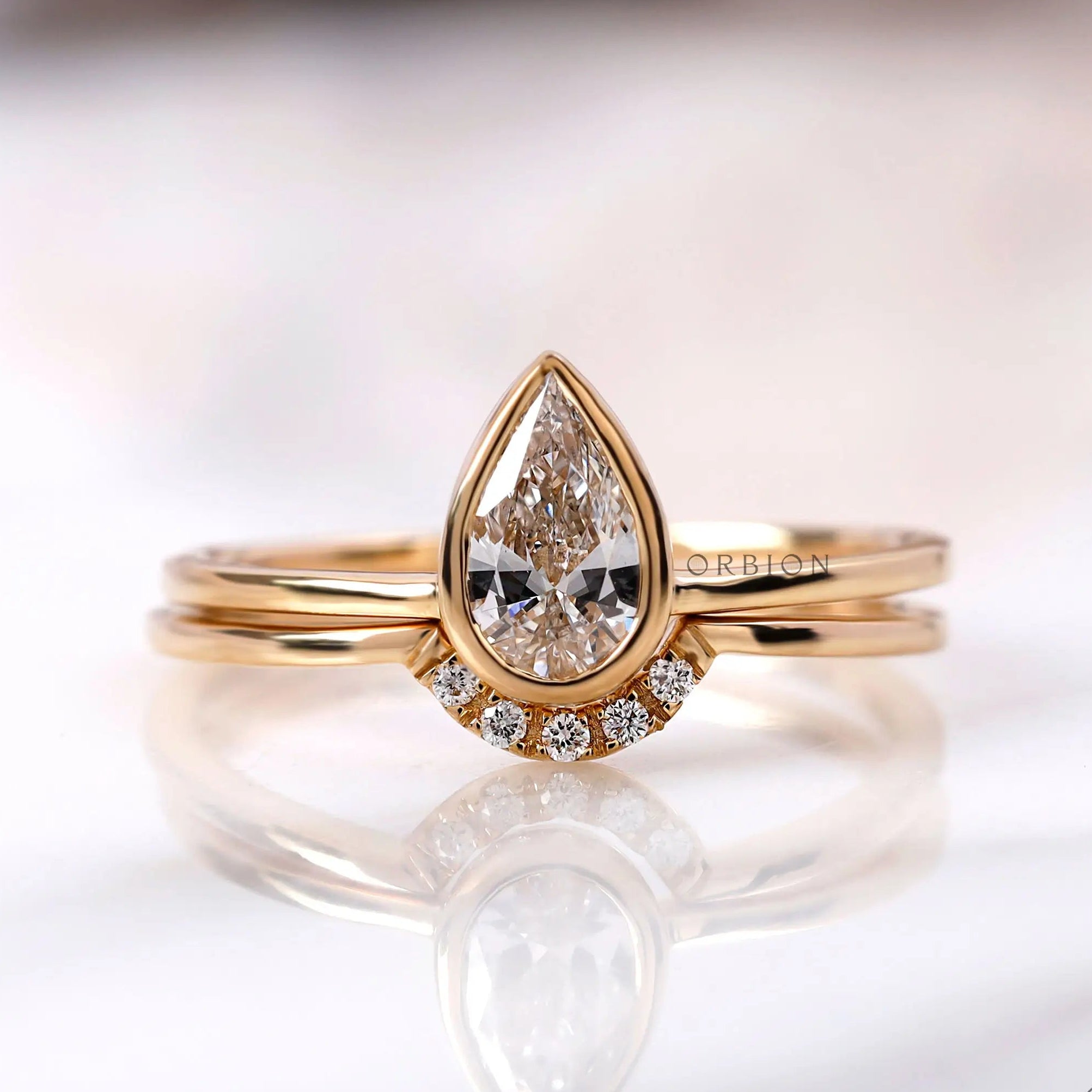 Pear shaped lab grown diamond engagement ring in 14K yellow gold