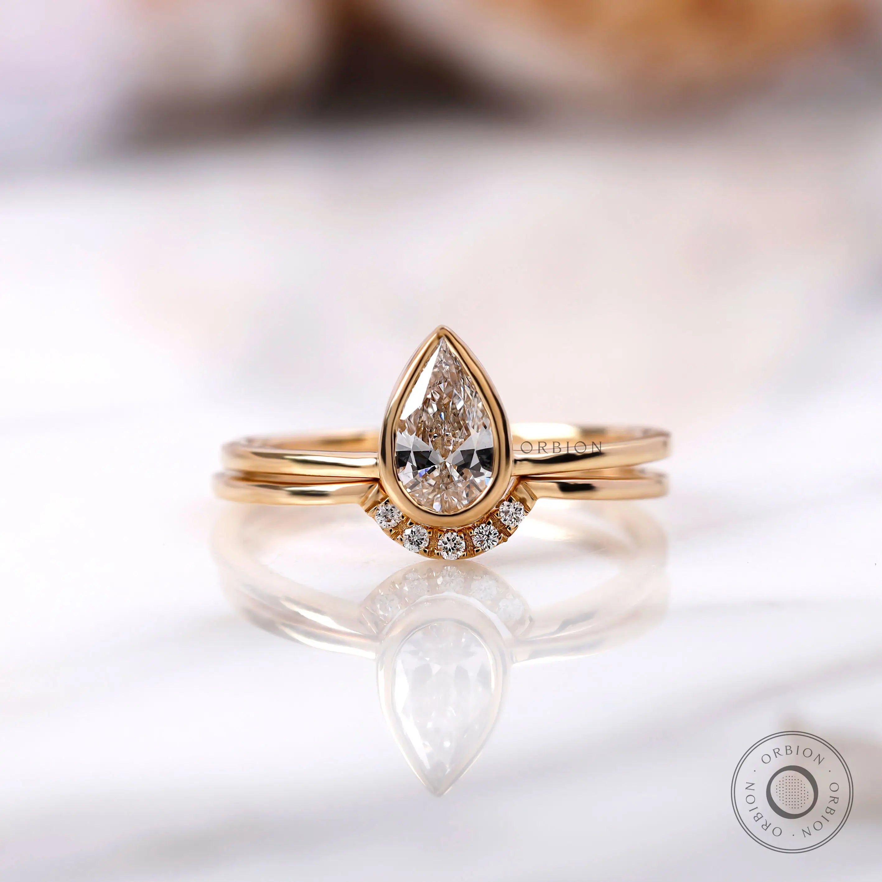 Pear shaped lab grown diamond engagement ring in 14K yellow gold
