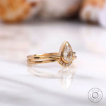 Yellow gold pear diamond half halo engagement ring set
