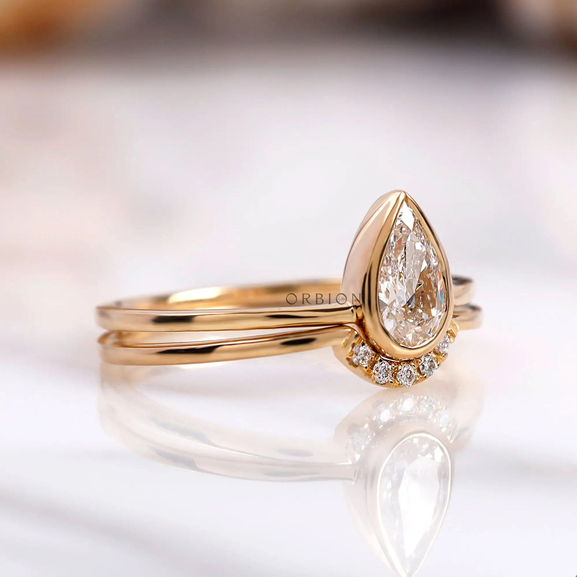 Yellow gold pear diamond half halo engagement ring set