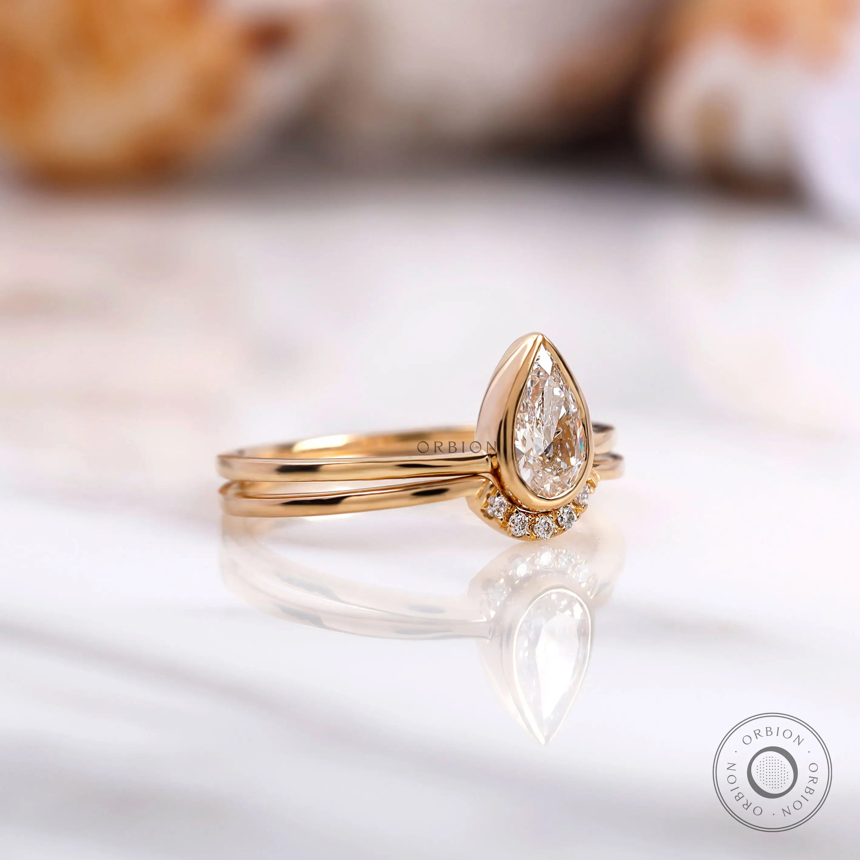 Yellow gold pear diamond half halo engagement ring set
