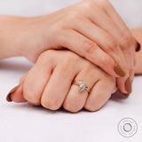 Pear diamond engagement ring worn on hand