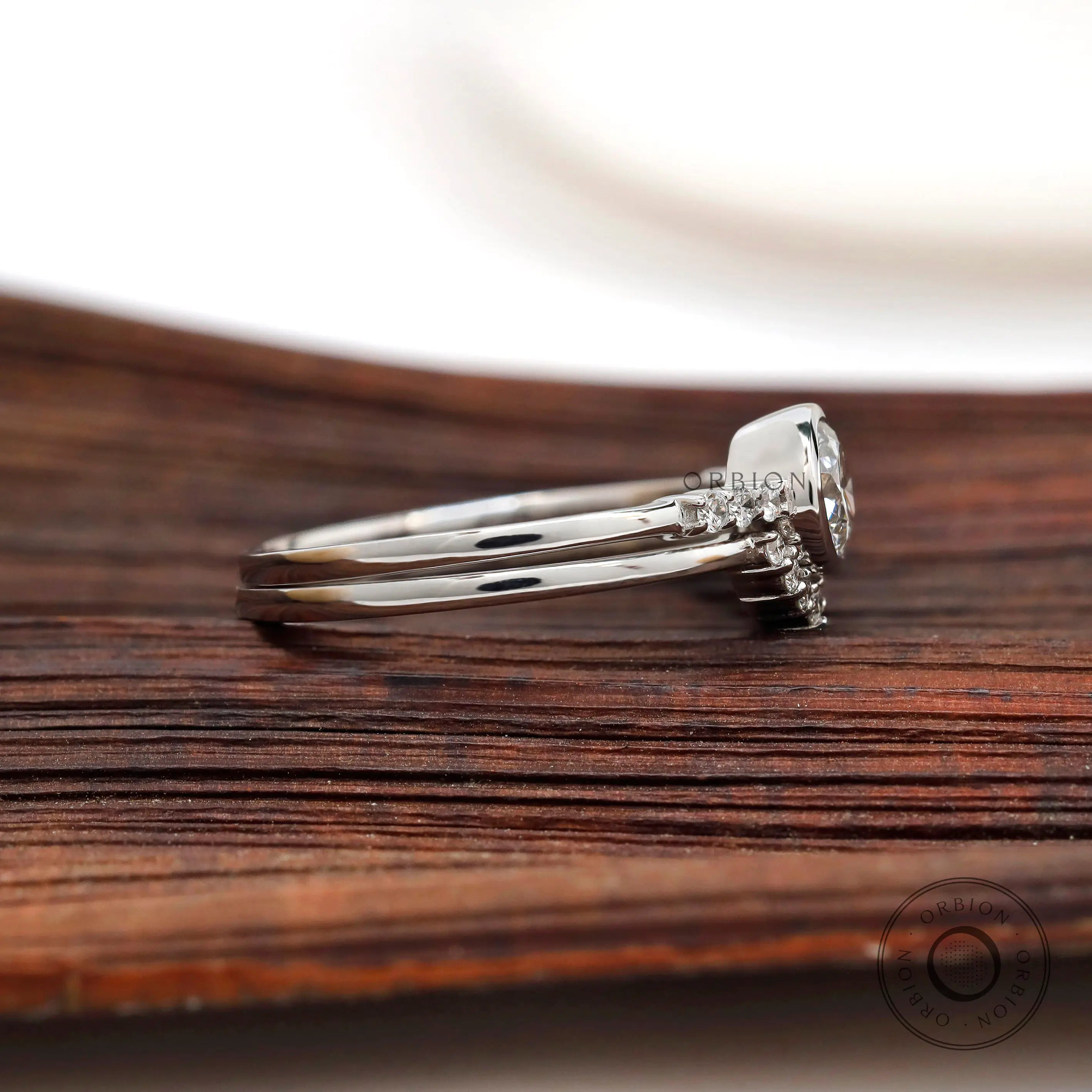 Side view of round lab grown diamond ring in white gold