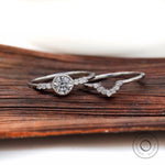 Matching contoured band with round diamond engagement ring