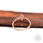 Close-up of marquise diamond cluster setting in rose gold
