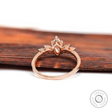 Close-up of marquise diamond cluster setting in rose gold
