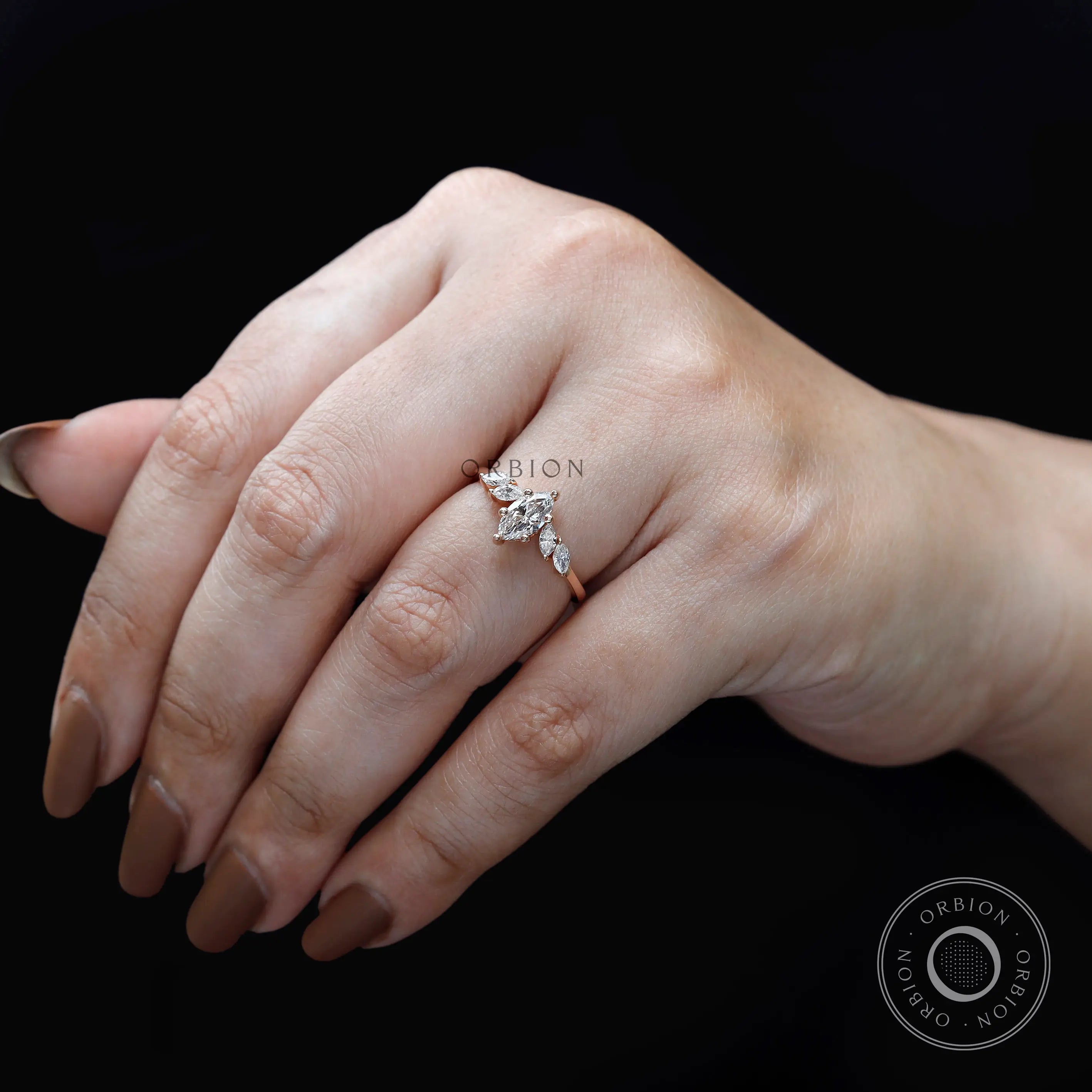 Marquise diamond cluster ring worn on hand