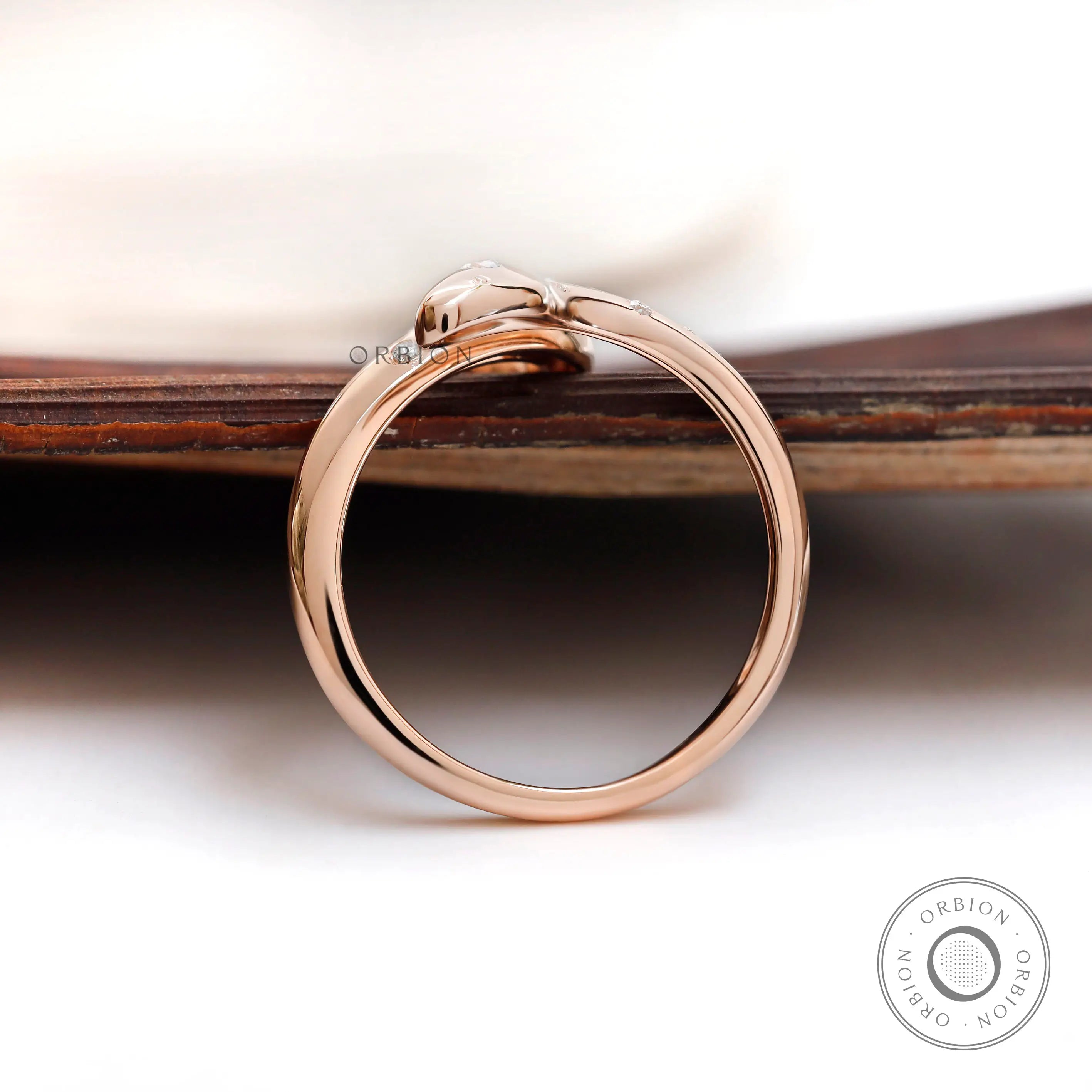 Open snake ring in high polish rose gold side view
