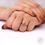 Minimalist diamond snake ring photographed on hand