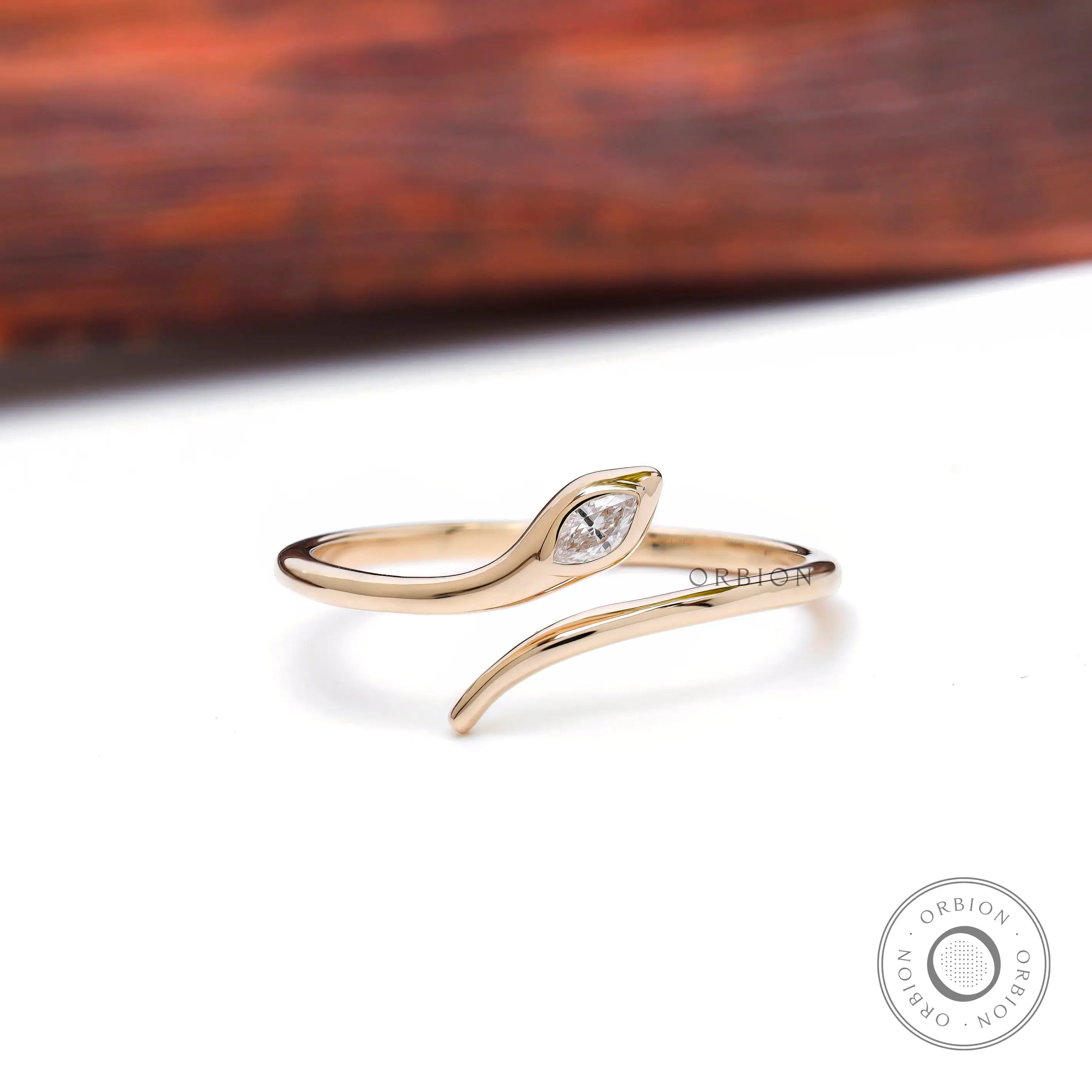Snake ring in 14K yellow gold with marquise diamond