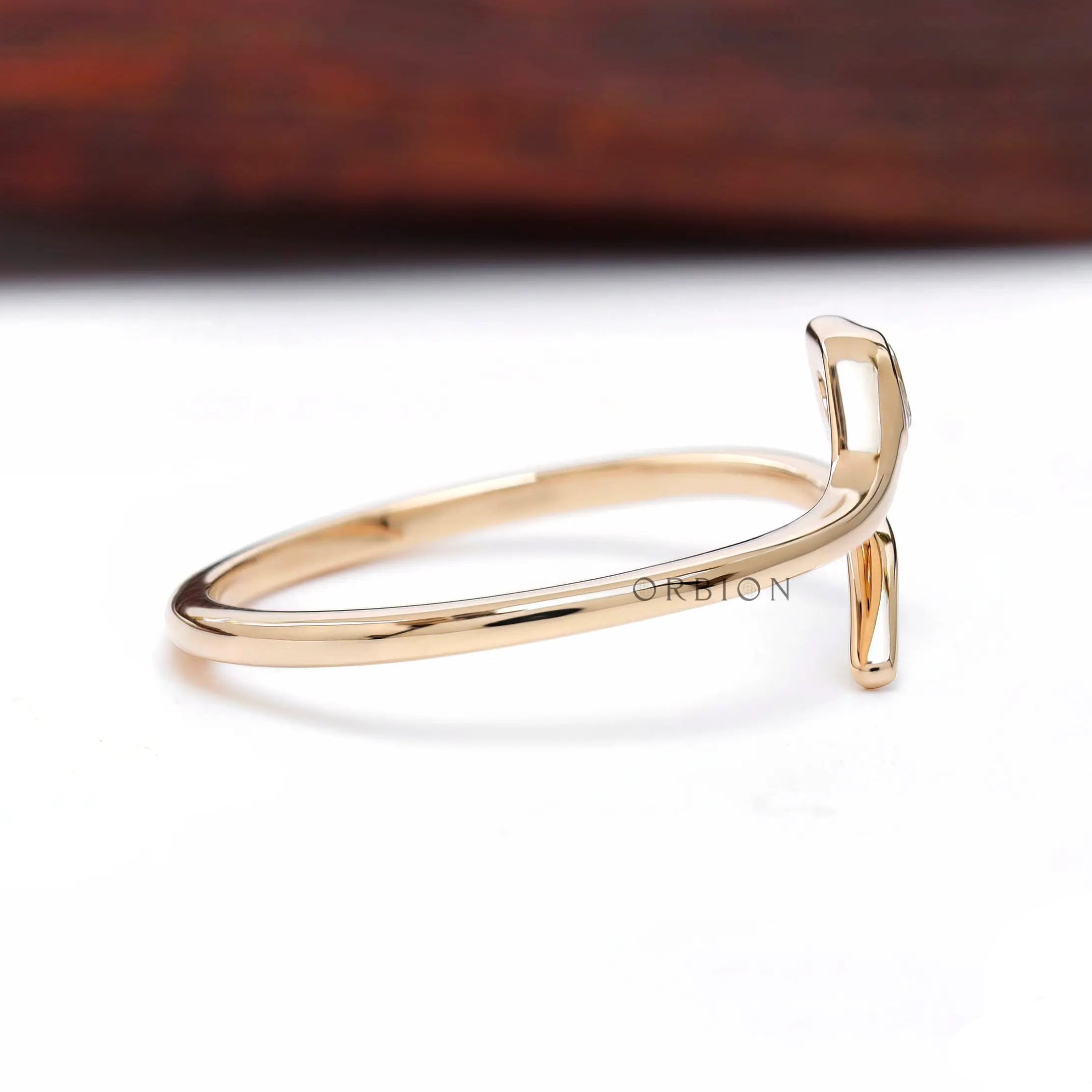 Side profile of open snake ring in 14K yellow gold