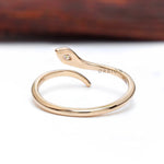 Contemporary minimalist snake ring with diamond detail