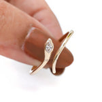 Modern open snake ring with marquise diamond