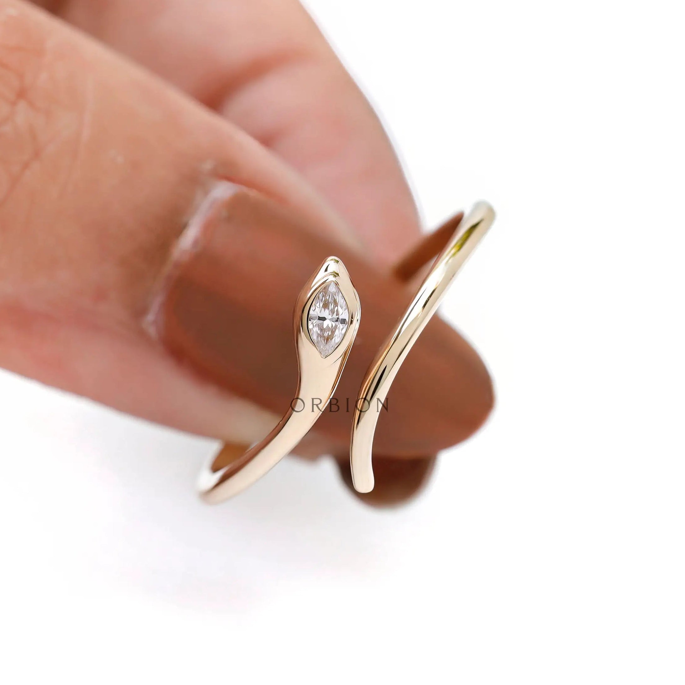 Modern open snake ring with marquise diamond
