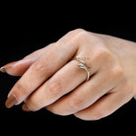 Elegant snake ring with marquise diamond on hand