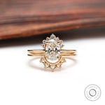 Oval lab grown diamond cluster engagement ring set in 14K yellow gold