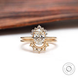 Oval lab grown diamond cluster engagement ring set in 14K yellow gold