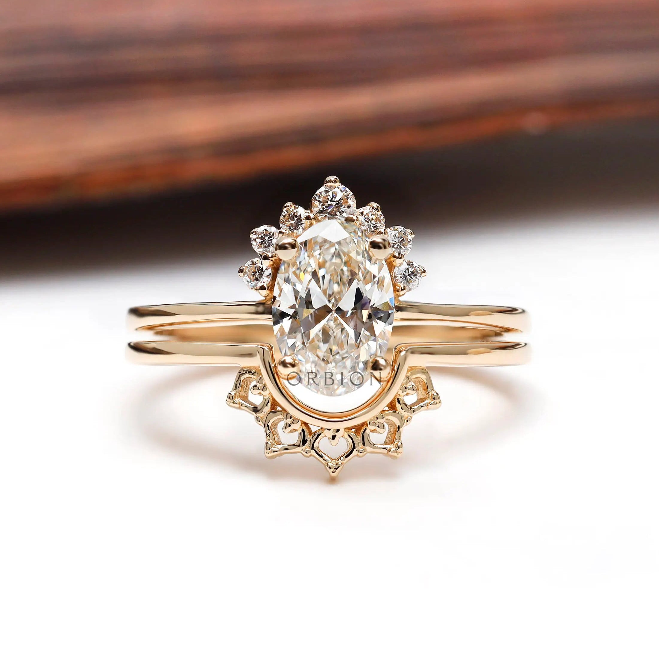 Oval lab grown diamond cluster engagement ring set in 14K yellow gold
