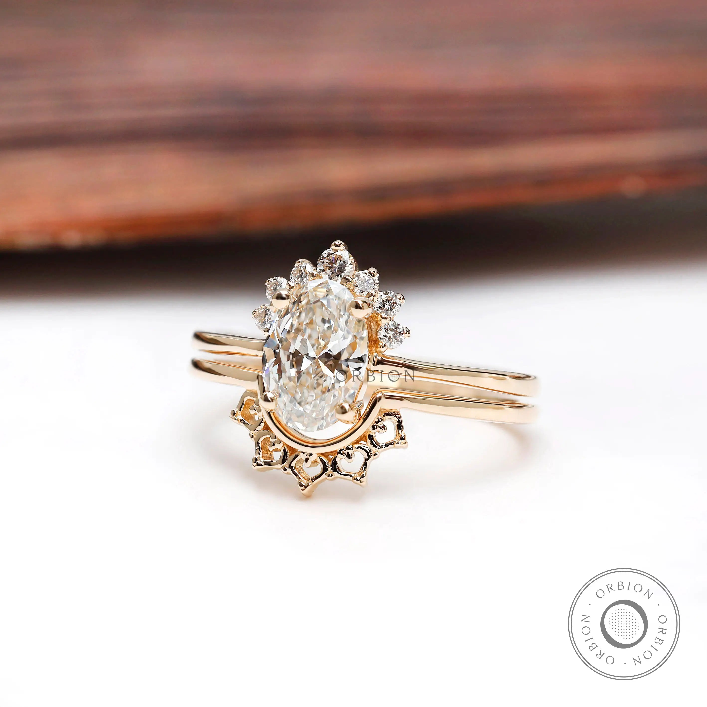 Yellow gold oval diamond cluster ring with matching band