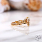 Side view of round lab grown diamond ring set in yellow gold