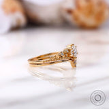 Side view of round lab grown diamond ring set in yellow gold