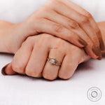 Close-up of heart and arrow cut round diamond engagement ring
