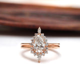 Pear lab grown diamond cluster engagement ring set in 14K rose gold