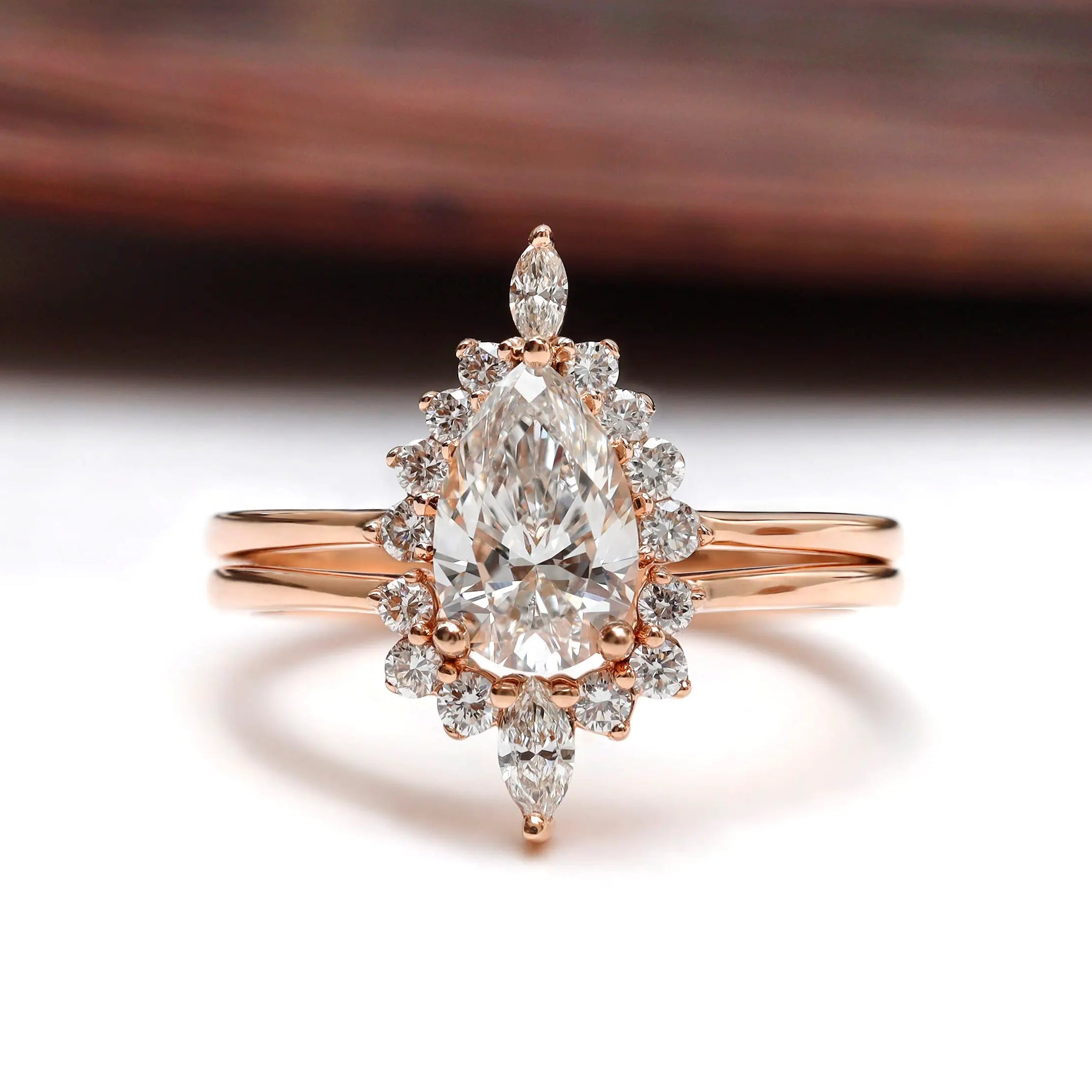 Pear lab grown diamond cluster engagement ring set in 14K rose gold